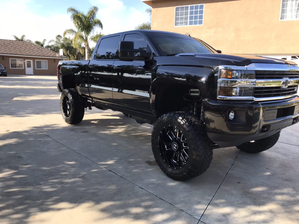 Glossy black Chevrolet 2500HD truck after full detail by Knights Mobile Detailing