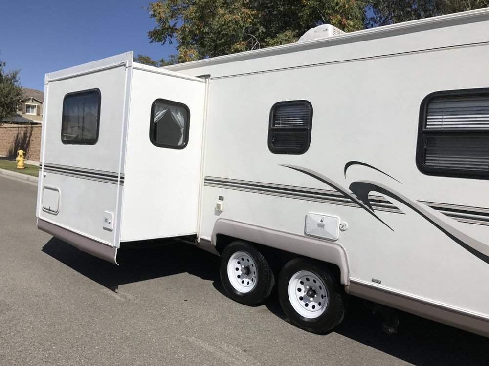 Travel trailer RV detailed by Knights Mobile Detailing in residential neighborhood