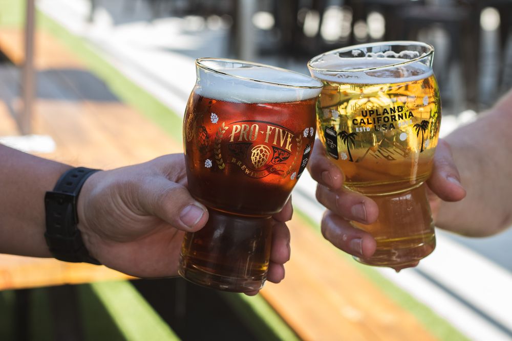 Cheers with Pro-Five branded glasses